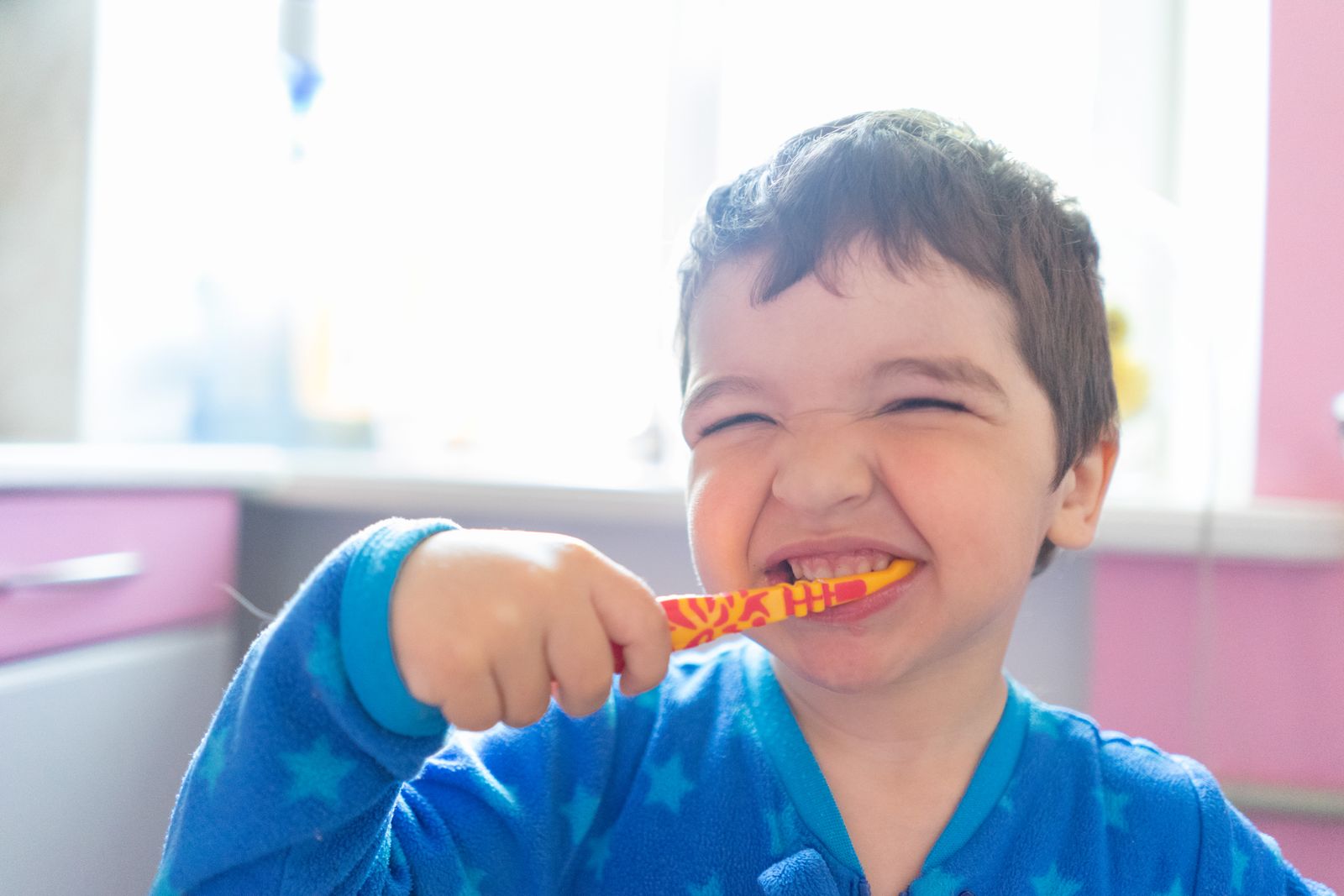 Child brushing teeth at home